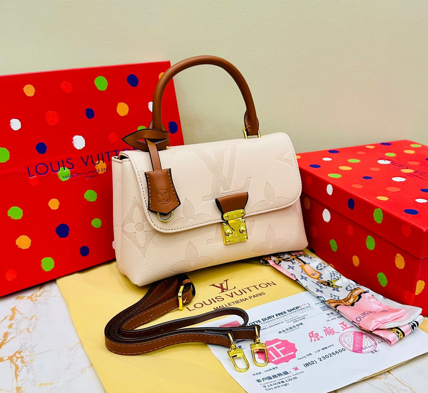 Louis Vuitton – Petite Lock Satchel