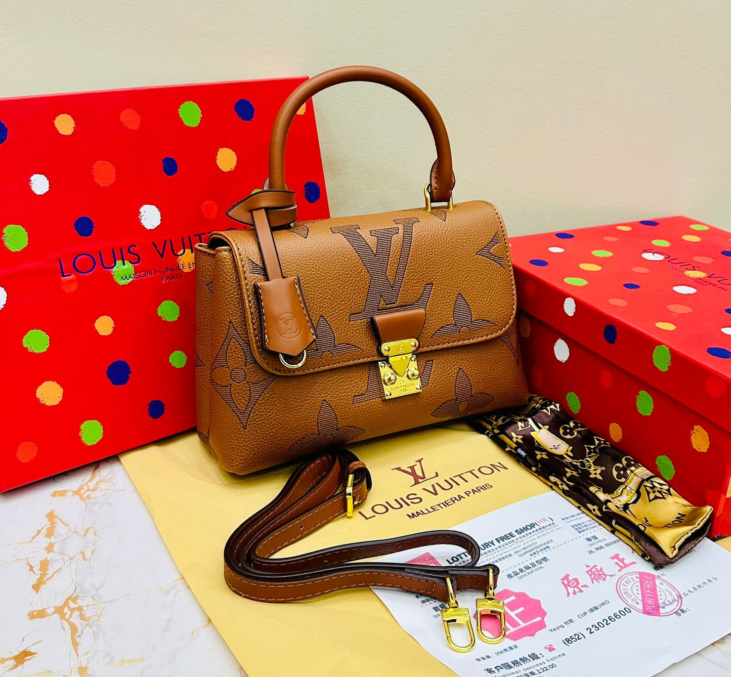 Louis Vuitton – Petite Lock Satchel