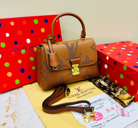 Louis Vuitton – Petite Lock Satchel