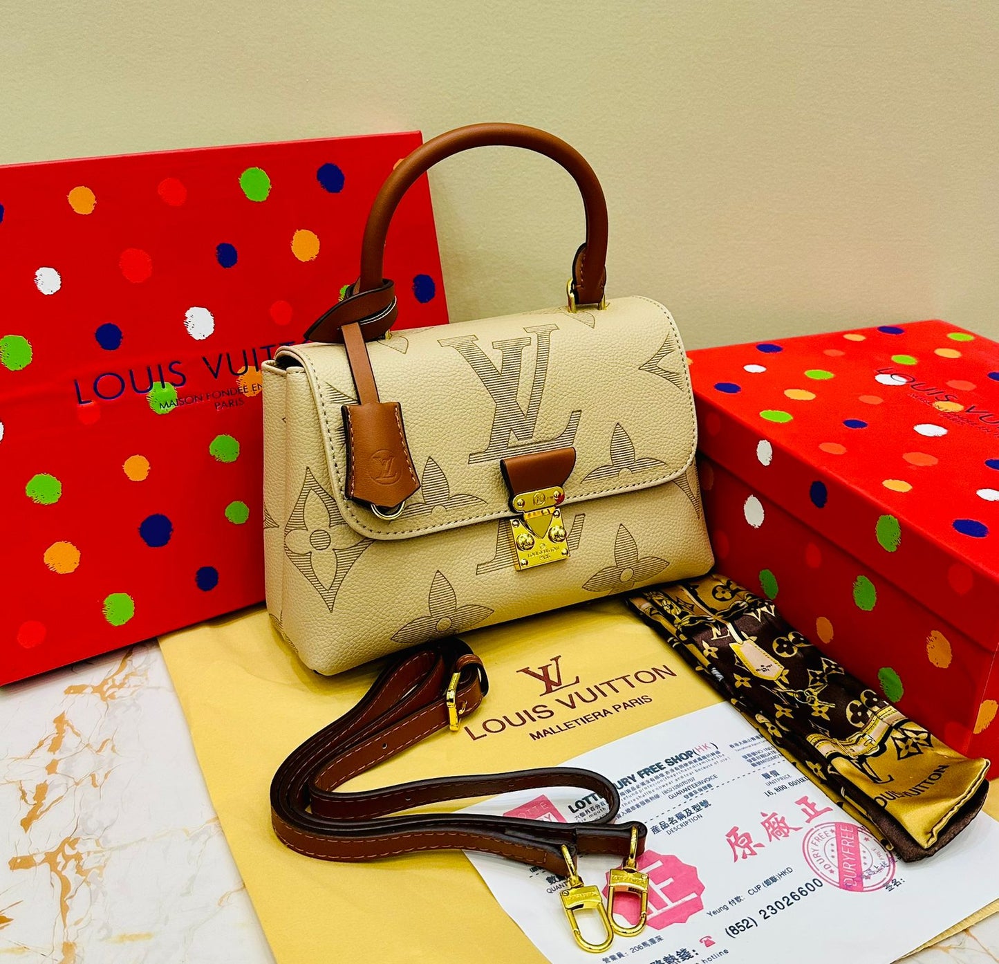 Louis Vuitton – Petite Lock Satchel