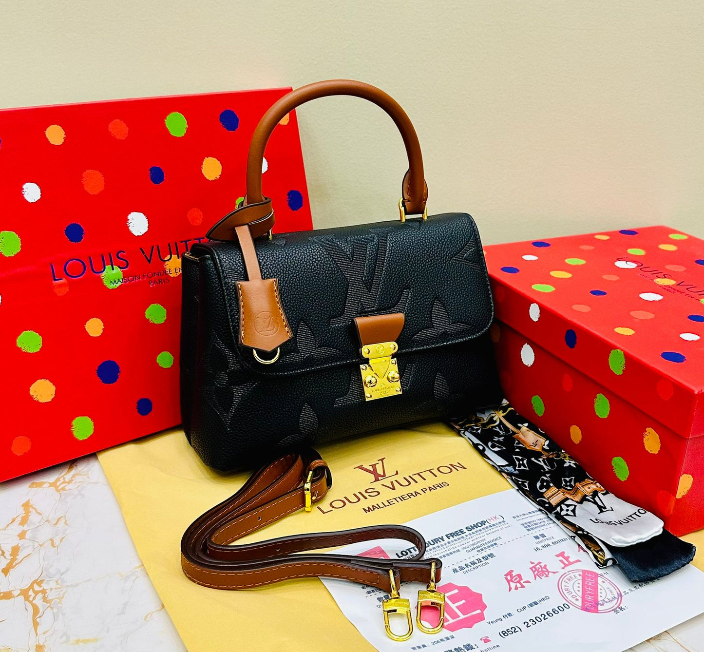 Louis Vuitton – Petite Lock Satchel
