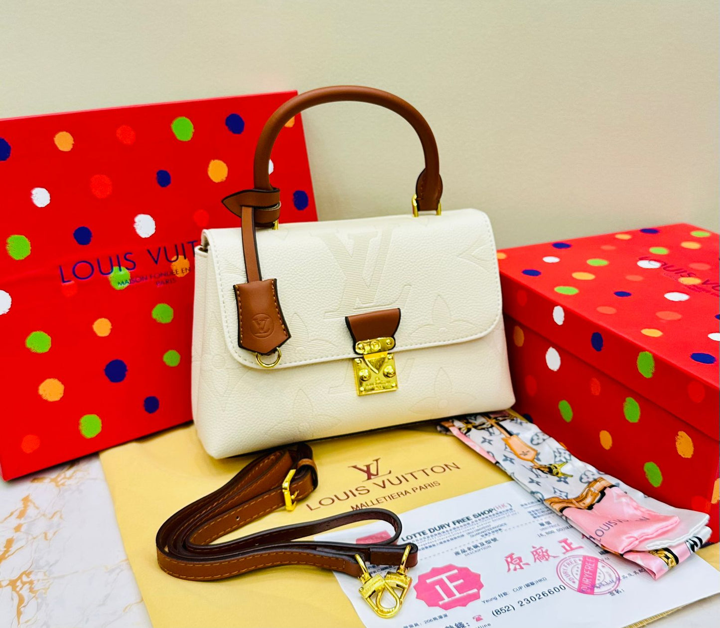 Louis Vuitton – Petite Lock Satchel